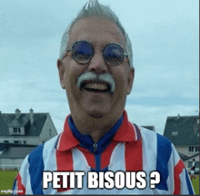 a man wearing glasses and a red white and blue striped shirt says petit bisous