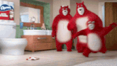 three red teddy bears are dancing in a bathroom with a roll of kleenex in the background