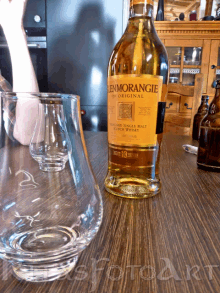 a bottle of glenmorangie whisky sits on a table