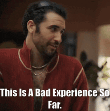 a man in a red jacket with the words " this is a bad experience so far "