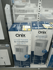 two boxes of onix 2.0 kw portable air conditioner with wi-fi on a shelf