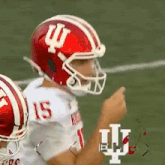 a football player wearing a red and white helmet with the letter i on it