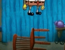 spongebob squarepants is hanging from a chair in a room
