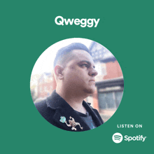 a man with a frog pin on his jacket is on a spotify advertisement