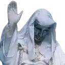 a statue of a man wearing a white robe is waving his hand .