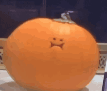 a pumpkin with a sad face carved on it