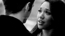 a man and a woman are looking into each other 's eyes .