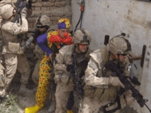 a group of soldiers with one wearing a clown costume and a patch that says tcccs