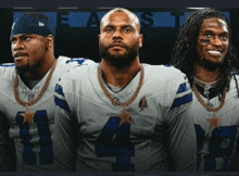 three cowboys players standing next to each other with the number 4 on their jerseys