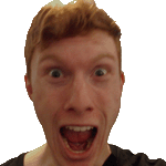 a man with red hair is making a funny face with his mouth wide open