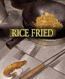 rice is being cooked in a wok with the words rice fried above it