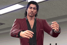 a man in a red suit stands in a room with his hands outstretched