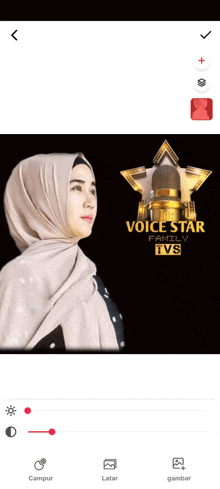 a woman in a hijab is standing in front of a voice star family ivs logo