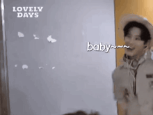 a man wearing a cowboy hat and headphones says baby