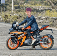 a man is sitting on a motorcycle that says ktm 125