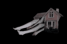 a picture of a house with a person 's legs coming out of it