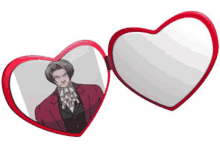 a heart shaped mirror with a picture of a man on it