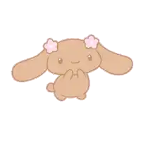 a brown bunny with pink flowers in its ears