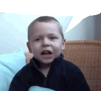 a young boy with a speech bubble behind him