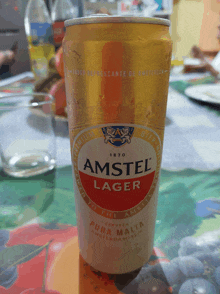 a can of amstel lager on a table