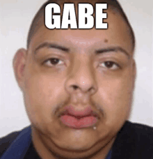 a close up of a man 's face with the word gabe on his forehead .