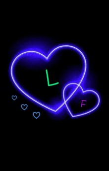 two neon hearts with the letter l and f on them on a black background