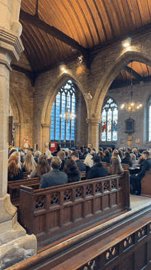 a church with a lot of people sitting in it