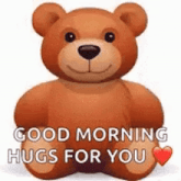 a teddy bear is sitting down and holding a heart and saying `` good morning hugs for you '' .