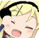 a close up of a cartoon character 's face with a yellow hair and a black headband .