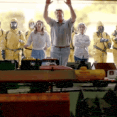 a man stands in front of a table with a sign that says loader on it