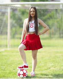 a cheerleader with the number 8 on her shirt