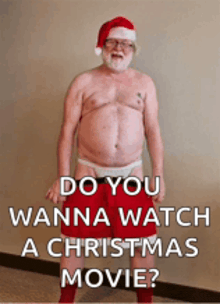 a man without a shirt is dressed as santa claus
