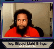 a picture of a man with a beard and headphones with the caption " ilay misajai light bringer @michaelcrits "