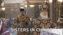 a priest is standing in front of a crowd with the words sisters in christ written on the screen .