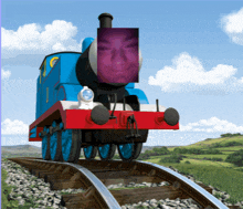 a blue train with a purple face on it