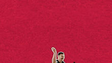 a man is dancing in front of a red background with the word woop on it