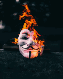 a mask with flames coming out of it 's eyes