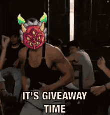 a man with a monster on his head says it 's giveaway time .