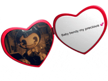 a heart shaped mirror that says baby bendy my precious on it