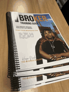 a book titled broker training guide is sitting on a table