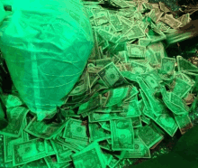 a pile of money with one dollar bills in the middle