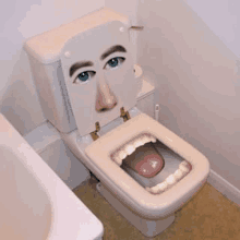 a toilet with a picture of a man 's face on the seat and tongue sticking out .