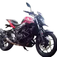 a red and black motorcycle with the word yamaha on the side