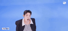 a group of young men are dancing in front of a blue background that says i love to