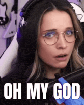 a woman wearing glasses and headphones with the words oh my god on her face