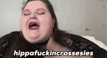 a woman is making a funny face with her mouth open and the words `` hippafuckingcrossesies '' written on the bottom .