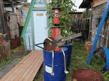 a blue barrel has a sticker on it that says ' stainless steel ' on it