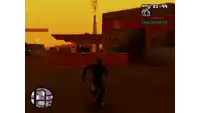 a video game screen shows a man running in front of a gas station at 21:44
