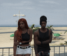 a man and a woman are standing next to each other on the beach