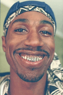 a close up of a man 's face with braces on his teeth